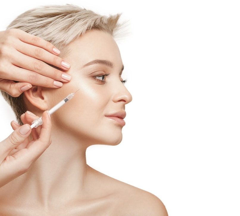 people-lips-cosmetology-plastic-surgery-beauty-concept-beautiful-young-woman-face-hand-with-syringe-making-injection_155003-28149